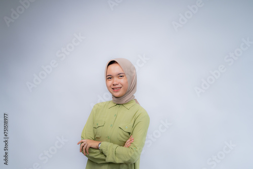 Portrait of young asian woman wearing hijab looking at the camera at Copy Space Advertising Your Text, Standing Isolated Over white Studio Background
