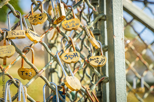 Close-up on love locks attached to a fence on Montmartre hill in Paris France photo