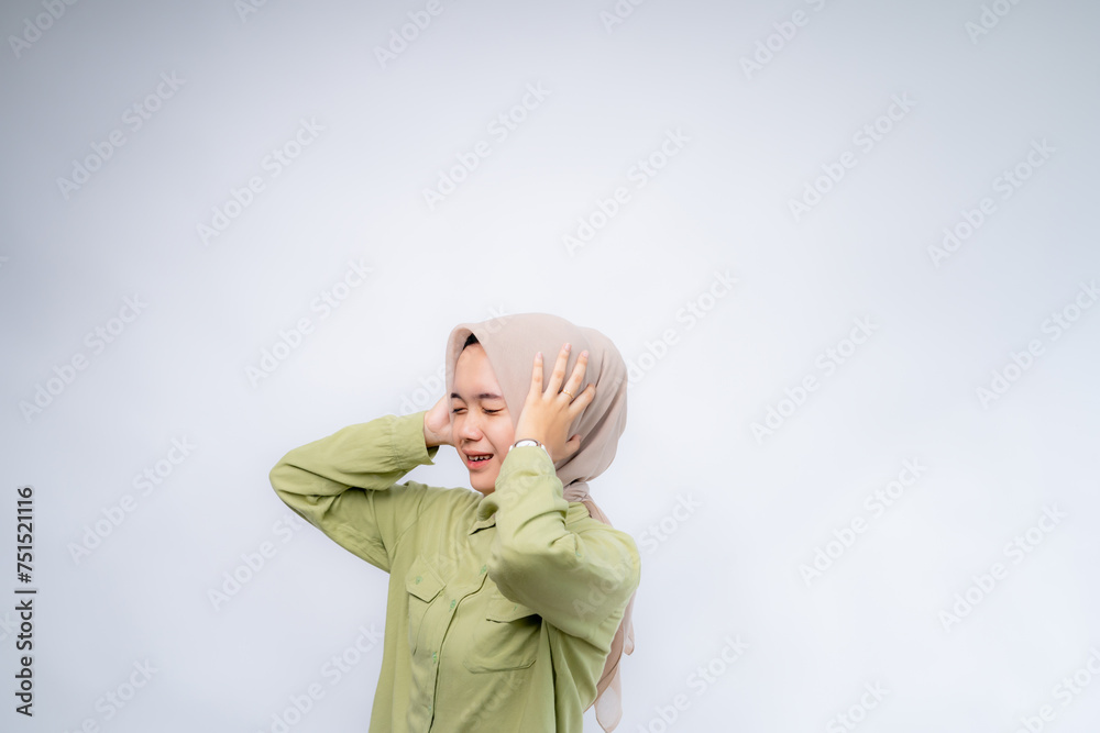 Confused and stress face of Young Asian women wearing hijab with hand gesture. Advertising model concept. Confused and stress face of Young Asian women wearing hijab with hand gesture. Advertising model concept.