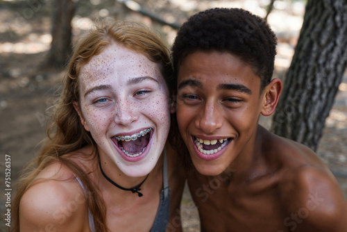 Teenage couple laughing with braces