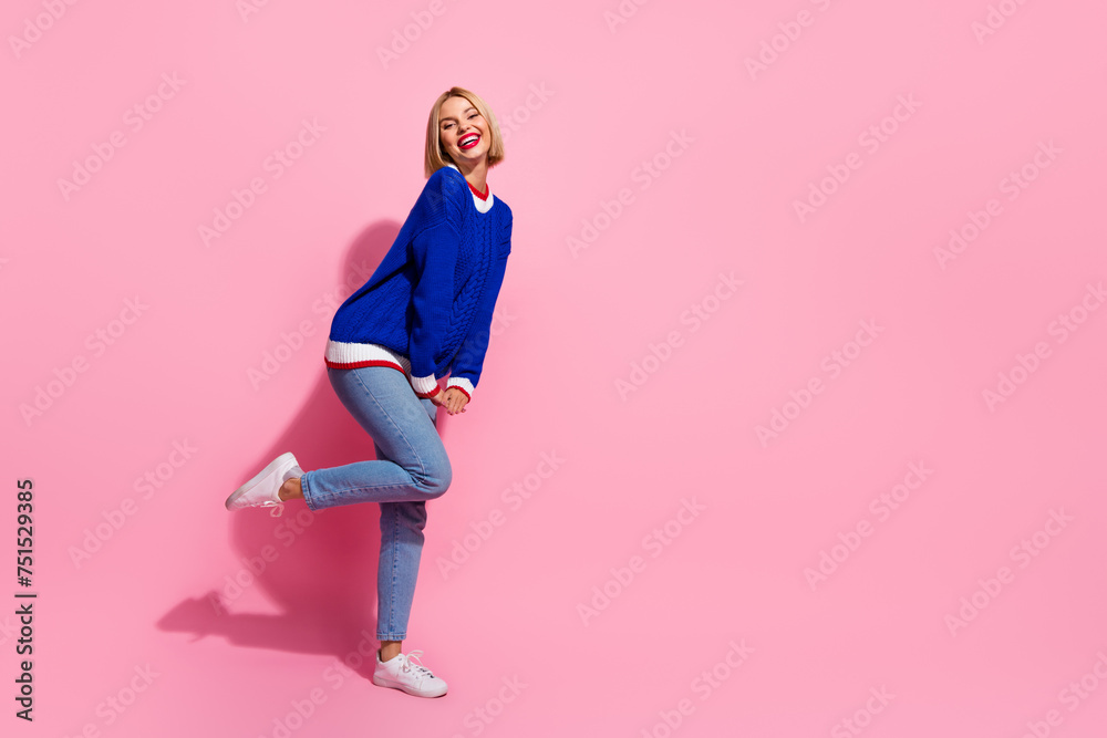 Full length body photo of woman in knitwear with jeans shy model enjoy new collection clothes discount isolated on pink color background