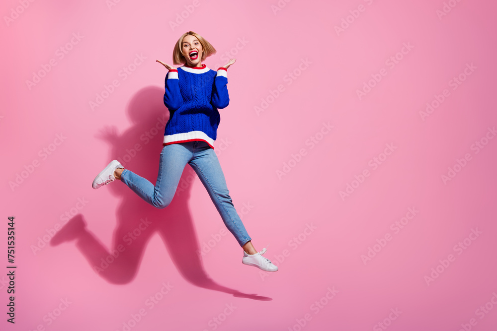 Full body size photo of overjoyed crazy girlfriend jumping raised arms up celebrating weekend party isolated on pink color background Full body size photo of overjoyed crazy girlfriend jumping raised arms up celebrating weekend party isolated on pink color background