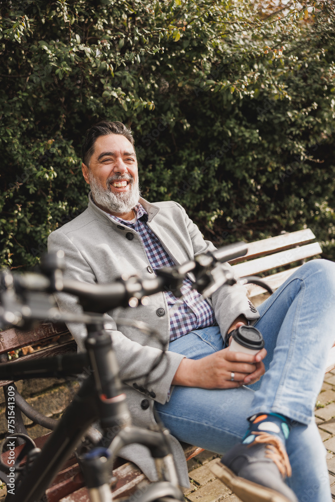 Man Sitting and Relaxing on a Park Bench Man Sitting and Relaxing on a Park Bench