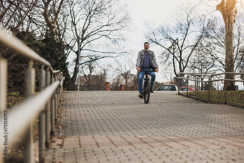 Man Riding Bike Down Brick Walkway