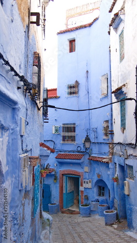 Alley between blue and white buildings in the medina in Chefchaouen, Morocco © Angela