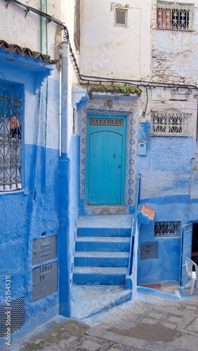 Blue doorway at the tops of steps, in the medina in Chefchaouen, Morocco © Angela