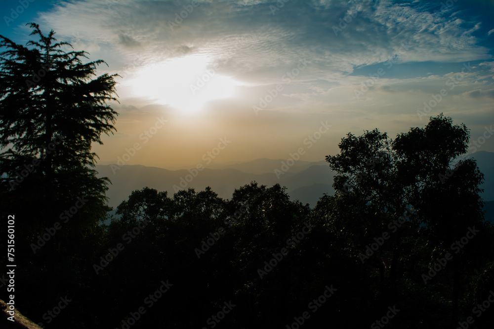 Sunset view from the mountains of Lansdowne. Mountain Sunset view in Lansdowne. Amazing  golden sunset seen through forest drive, Lansdowne Uttarakhand.