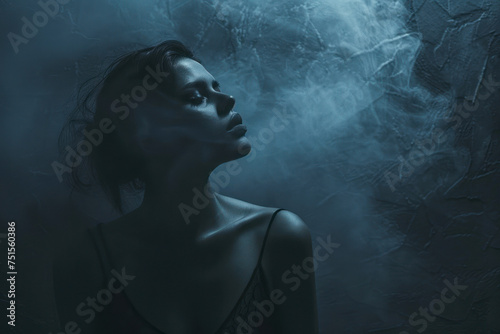 Creative concept portrait photography against a moody gradient background transitioning from deep indigo to charcoal gray.