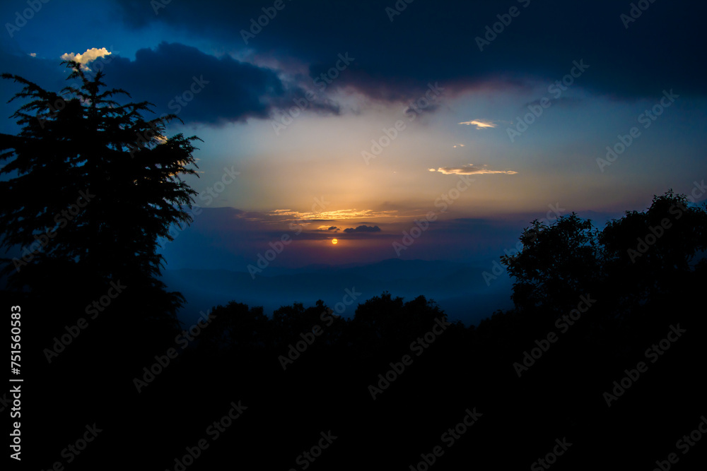 Sunset view from the mountains of Lansdowne. Mountain Sunset view in Lansdowne. Amazing  golden sunset seen through forest drive, Lansdowne Uttarakhand.