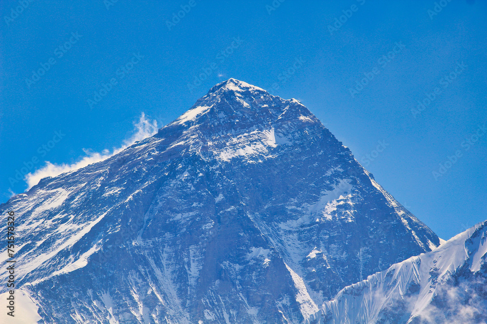 Mount Everest gigantic West Face close up along with summit and south summit in this long range photo taken from the top of Gokyo ri in Nepal