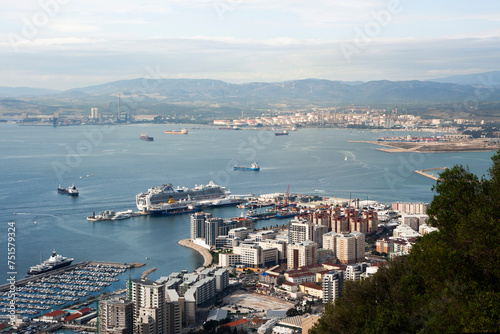 Rock of Gibraltar top view. High mountain over the sea. Sunny cityscape background. British territory landscape. Harbour coastal city panoramic view. © Paweł Michałowski