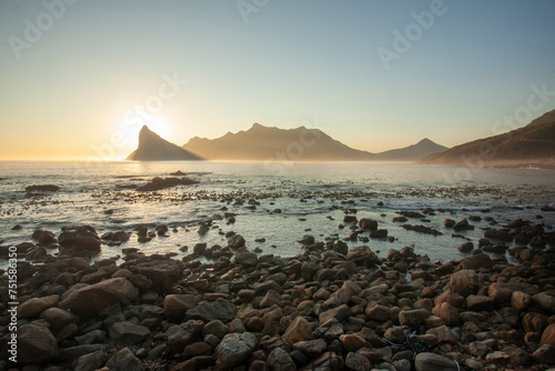 View of the Sentinel over Hout Bay from the Chapman's Peak shore, at sunset, in Cape Town, South Africa, south Africa.