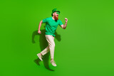 Full body profile photo of crazy sporty person jump run empty space isolated on green color background