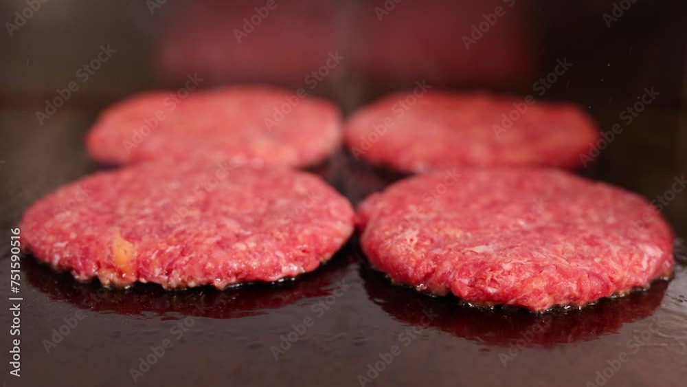 Cutlets and burger buns fried in a pan, street food Cutlets and burger buns fried in a pan, street food