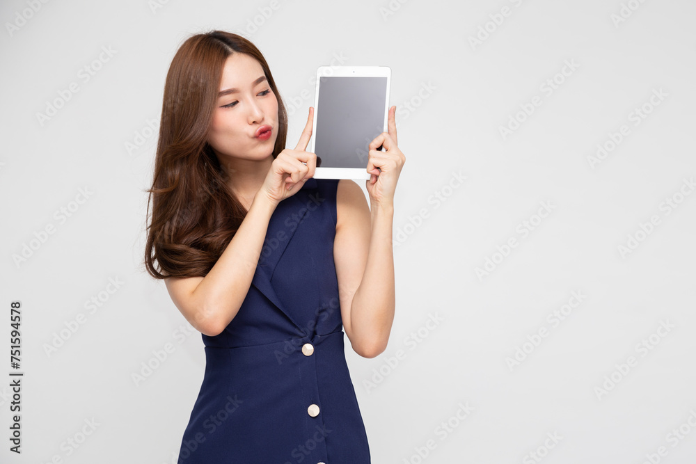 Portrait of young Asian businesswoman showing or presenting blank screen tablet application on hand isolated over white background Portrait of young Asian businesswoman showing or presenting blank screen tablet application on hand isolated over white background
