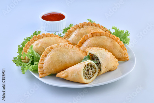 Delicious Half Circle Shape Samosa, stuffed with spicy chicken and herbs
