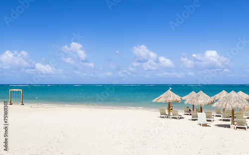 Tropical beach calm scene, chairs and umbrella a sunny day
