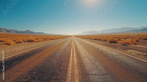 The road winds along empty roads through a barren desert landscape.