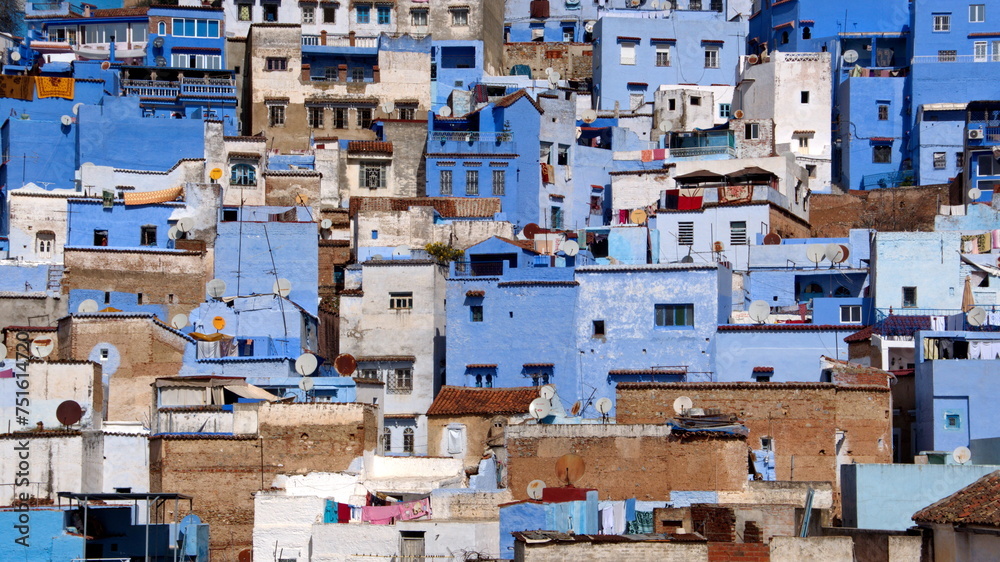 Blue and white buildings on a slope in the medina, in Chefchaouen, Morocco