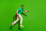 Full body profile photo of crazy guy jump rush hold beet empty space isolated on green color background