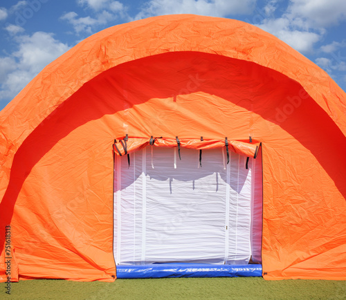 Orange pneumoframe modular tent in a field hospital at the stadium photo