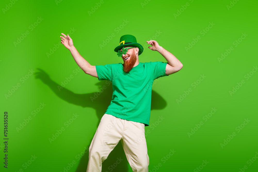 Portrait of positive extravagant person have good mood dancing chilling isolated on green color background Portrait of positive extravagant person have good mood dancing chilling isolated on green color background