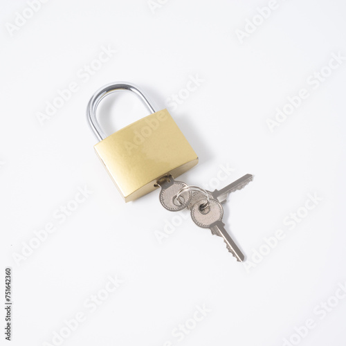 Golden padlock with a key isolated on white background