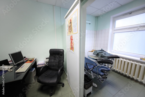  interior of exam room gastroenterologist with study poster about treatment of motor disorders of digestive tract on wall inside in Center Endosurgery and Lithotripsy