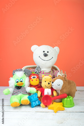 Collection of colorful toys on an orange background. Kids toys.