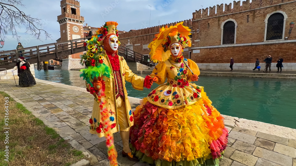 Naklejka premium Venice Carnival. People in Venetian carnival masks and costumes on streets of Venice, Italy, Europe February 10, 2024