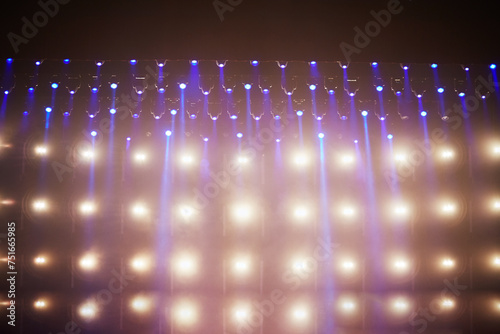 Fototapeta Naklejka Na Ścianę i Meble -  Spotlight beams above stage at music concert