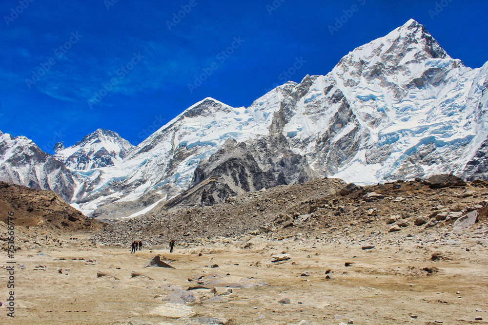 Nuptse towers over the plains near Gorakshep in this bright afternoon view from the base of Kala pathar, Nepal