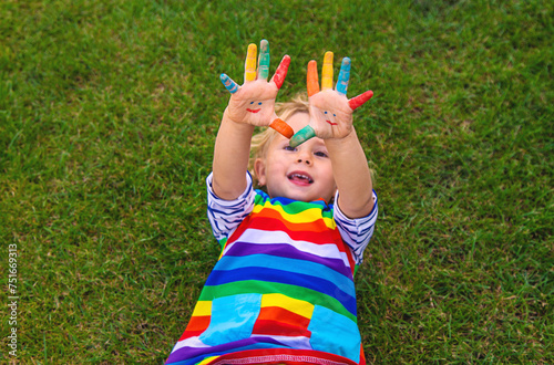 Child in hand draw smile. Selective focus.