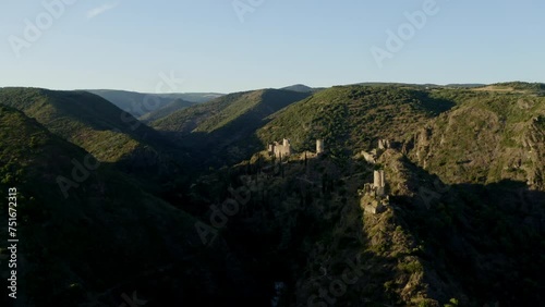 Aerial shot during the sunset of the four castles of Lastours in the south of France. photo