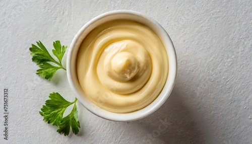 top view on a cup of mayonnaise on white background