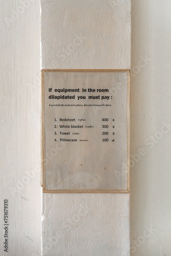 Price list on the wall of a low budget hotel room in a Chinese hotel in the city of Ranong, Thailand