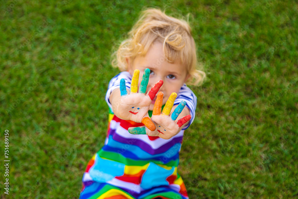 Child in hand draw smile. Selective focus. Child in hand draw smile. Selective focus.