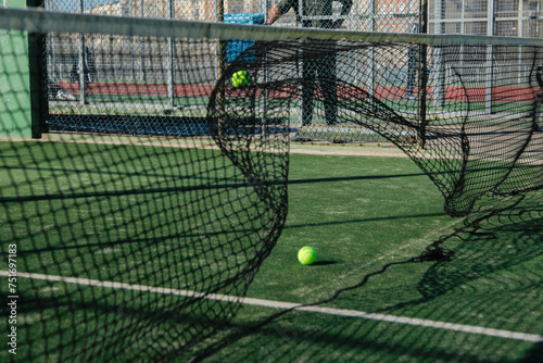 padel or tennis ball moving the net