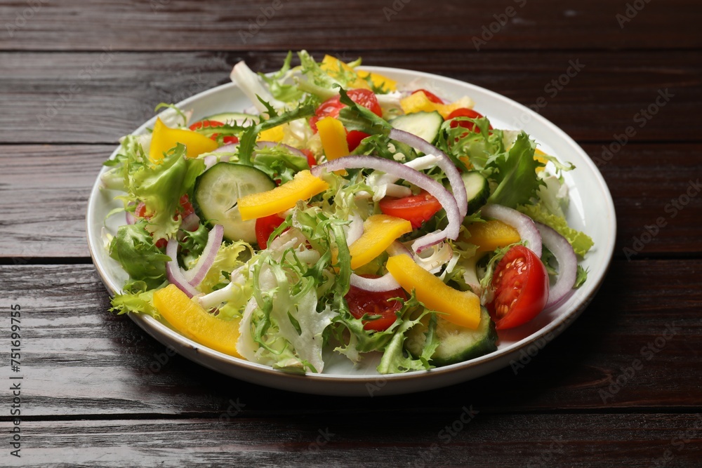 Tasty fresh vegetarian salad on dark wooden table, closeup
