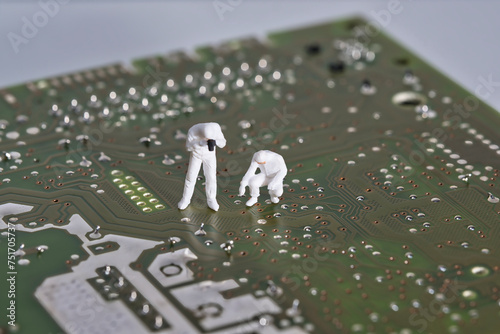 Working on an electronic component, photography of miniature figures