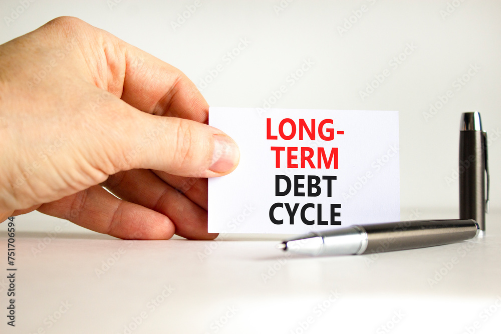 Long-term debt cycle symbol. Concept words Long-term debt cycle on beautiful white paper. Beautiful white background. Businessman hand. Business Long-term debt cycle concept. Copy space. Long-term debt cycle symbol. Concept words Long-term debt cycle on beautiful white paper. Beautiful white background. Businessman hand. Business Long-term debt cycle concept. Copy space.