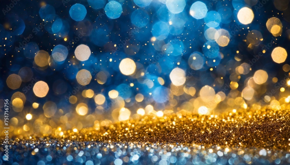 blue and gold bokeh particles abstract background festive christmas gold and blue glitter