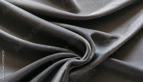 black gray satin dark fabric texture luxurious shiny that is abstract silk cloth panorama background with patterns soft waves blur beautiful