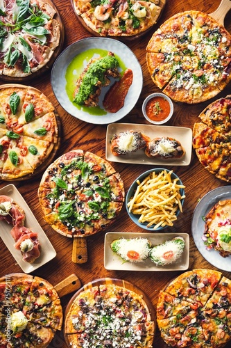 Mouthwatering Spanish Pizzas Spread on Table in 4K Ultra HD Resolution