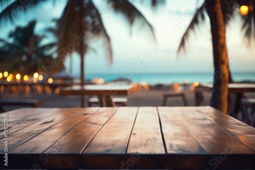 Wooden table top on blurry background of sea island and fresh blue sky, Wooden table top with blurry beach in the backdrop at dusk, Ai generated © Tanu