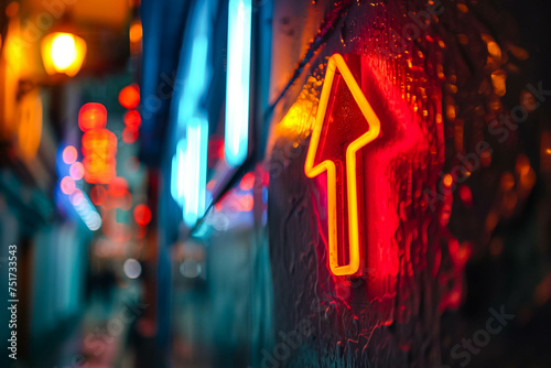 Detailed shot of a neon arrow pointing upwards symbolizing financial prosperity © SObeR 9426