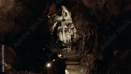 Forward tracking shot of the giant chasm of Cabrespine in southern France. Cinematic shot of a big cave.
