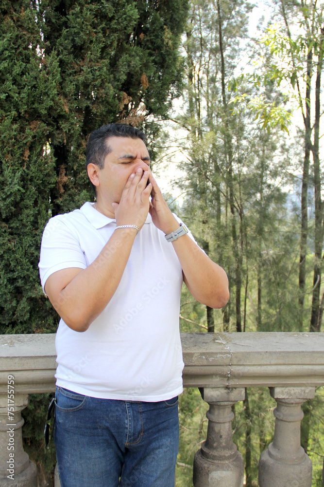 40-year-old dark-skinned Latino man suffers from irritated eyes, nose, and throat due to the flu, allergies, and environmental pollution 40-year-old dark-skinned Latino man suffers from irritated eyes, nose, and throat due to the flu, allergies, and environmental pollution