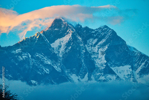 Lhotse south face rises over 4 kms from the surrounding valley presenting a magnificent view from the village of Pangboche, Nepal photo