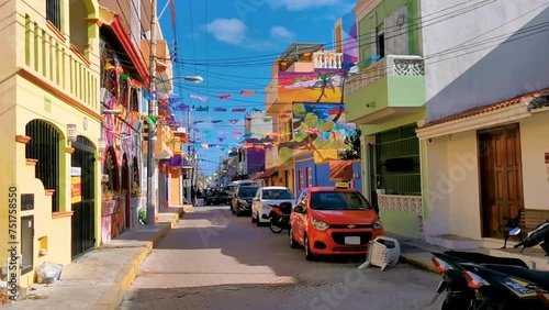 Typical colorful tourist streets sidewalks restaurants stores Isla Mujeres Mexico. photo